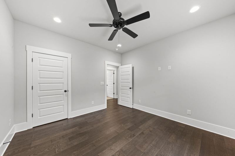 Fourth bedroom with backyard views