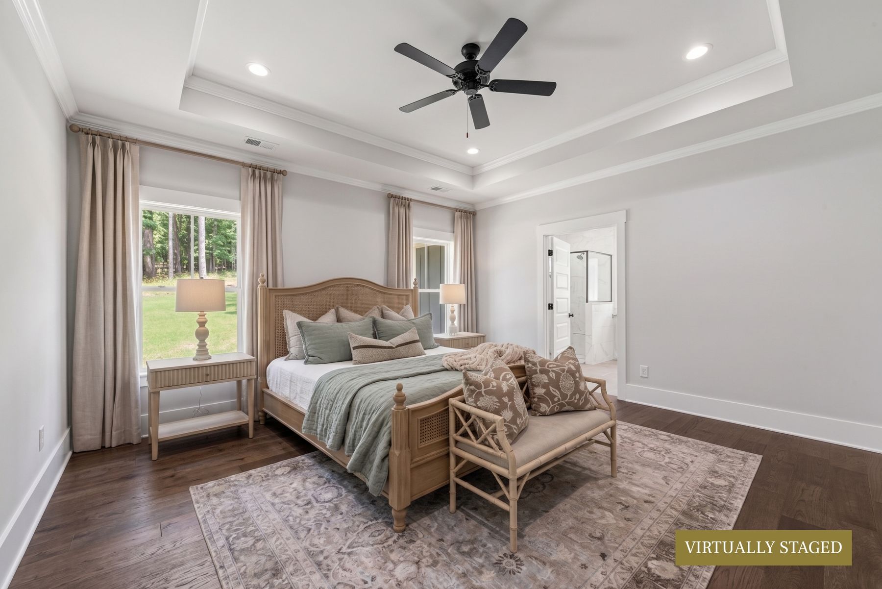 Primary suite with trey ceiling and sitting area