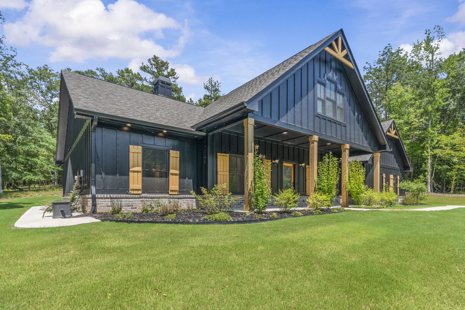 Front elevation of 1231 Spinnaker with covered rocking-chair porch