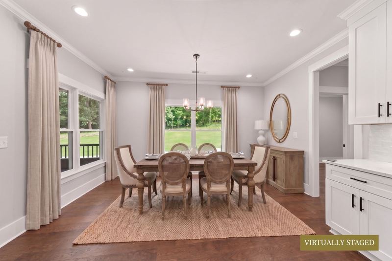 Dining room with chandelier and porch views