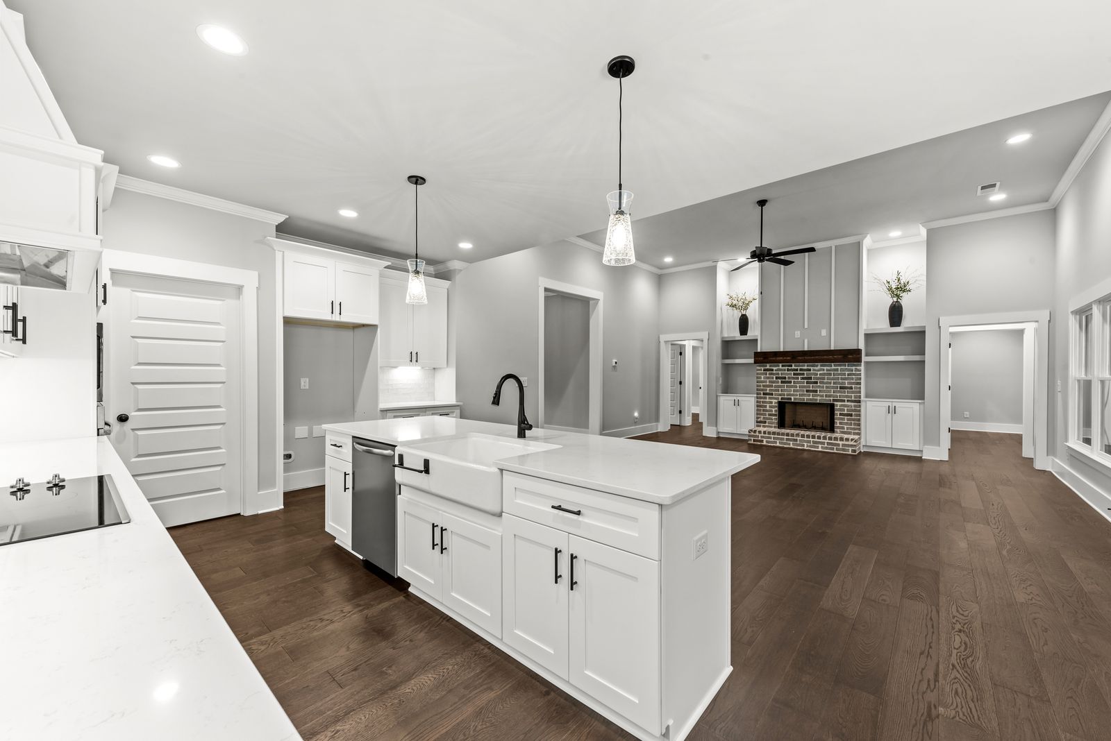 Chef's kitchen with oversized island, stainless appliances and walk-in pantry