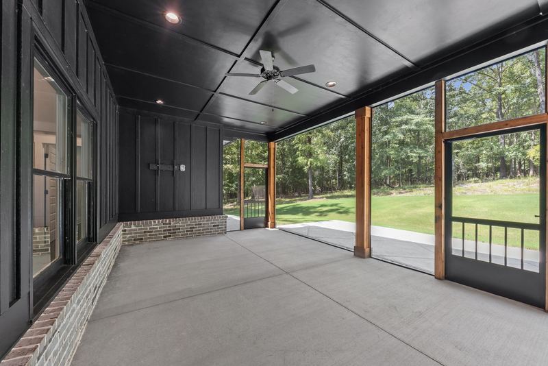 Screened porch with backyard views